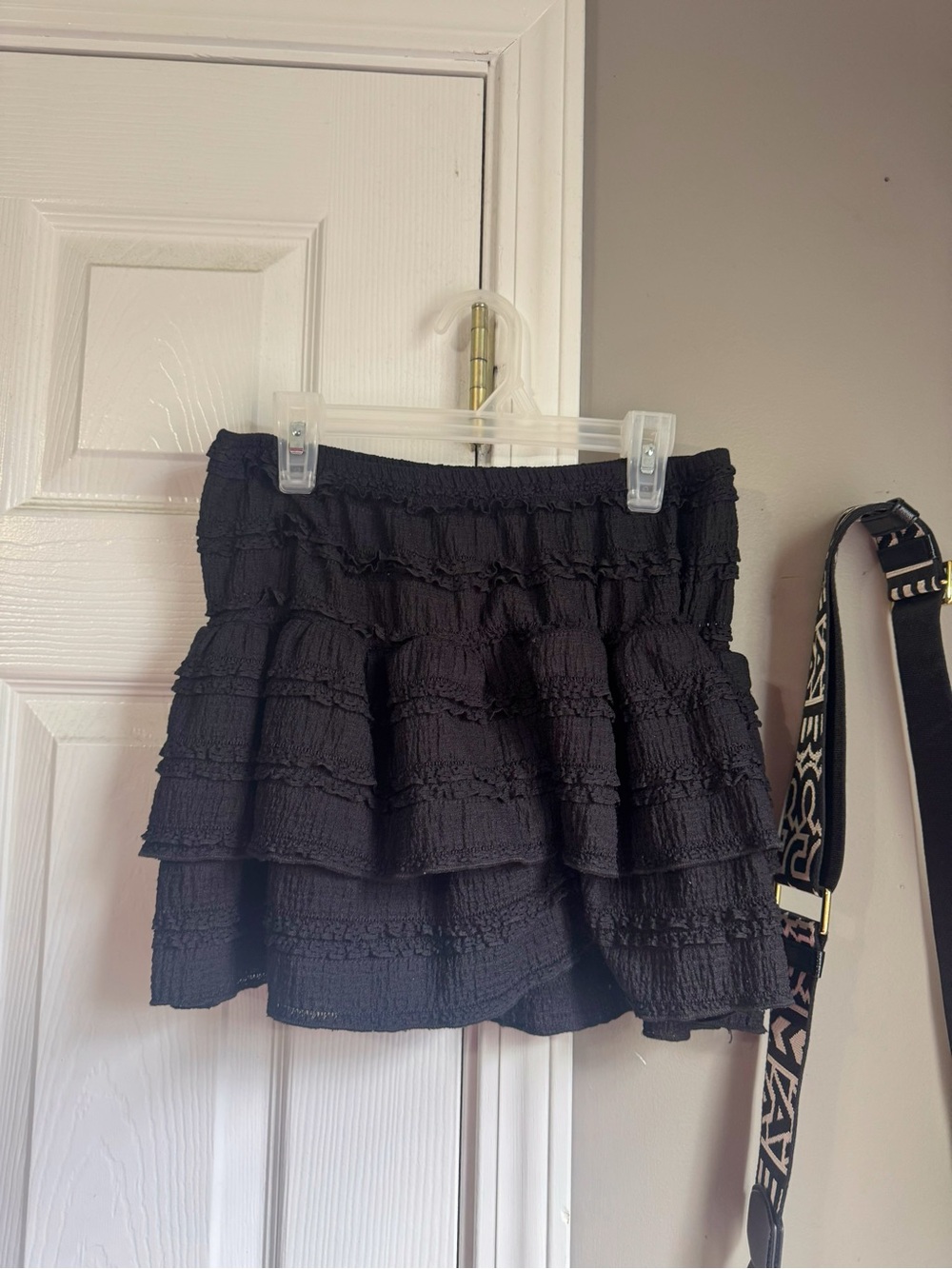 Black ruffle mini skirt